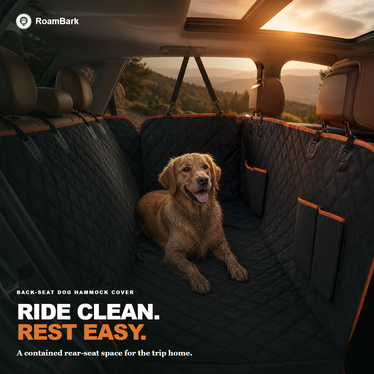 Golden retriever lying in the black quilted hammock cover with orange trim, fitted across an SUV back seat.