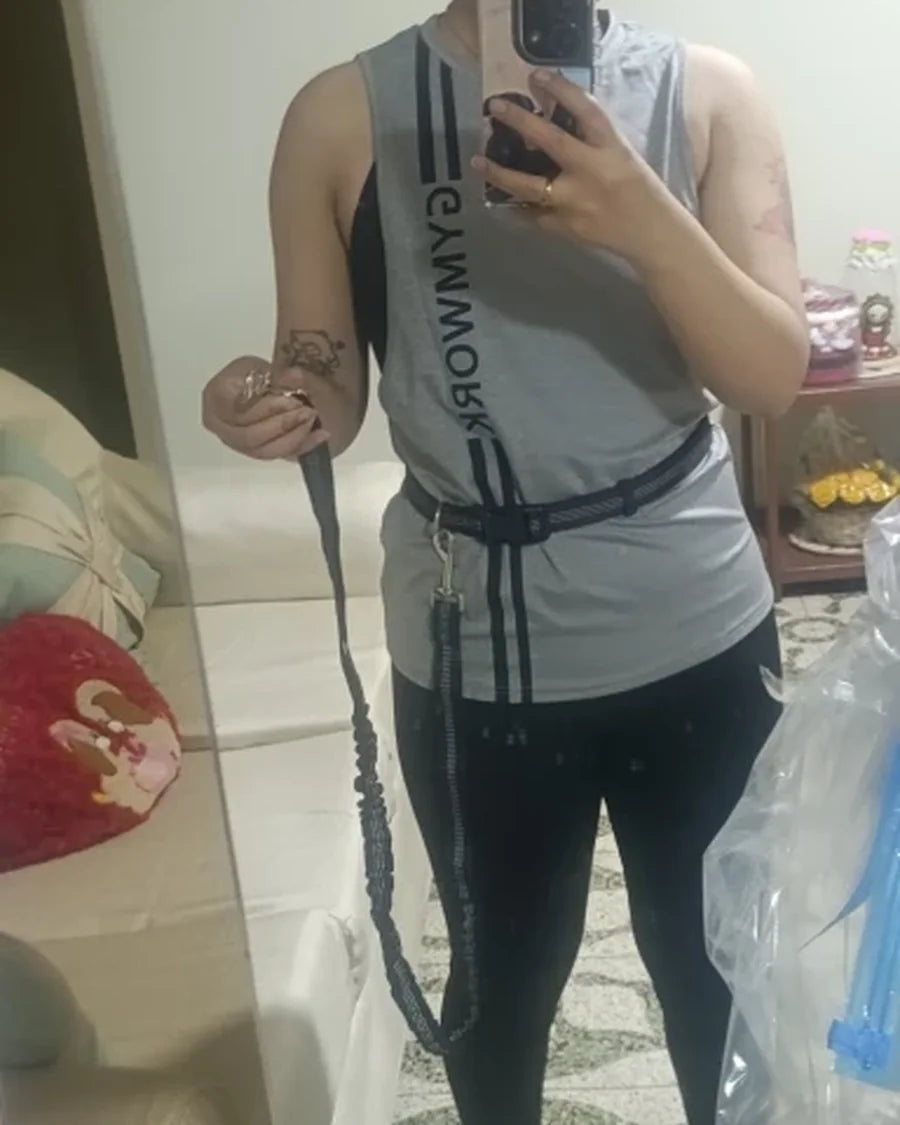 Dog and owner moving together with the Roam Bark hands-free running leash